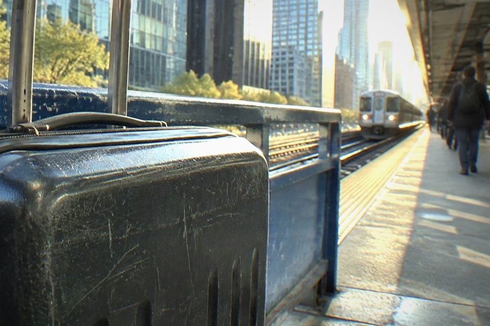 AirTrain JFK station platform with passengers and luggage